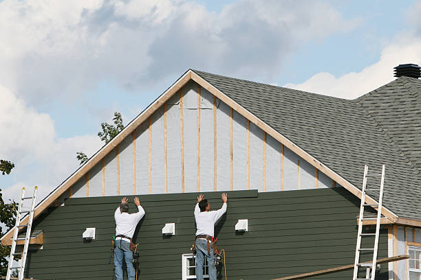 Professional Storm Damage Siding Repair technician working in Lawrence, MA